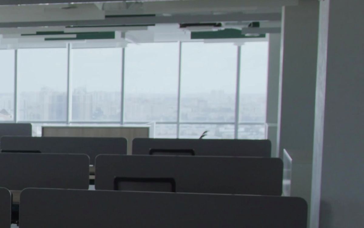 Interior glass partition in a commercial space